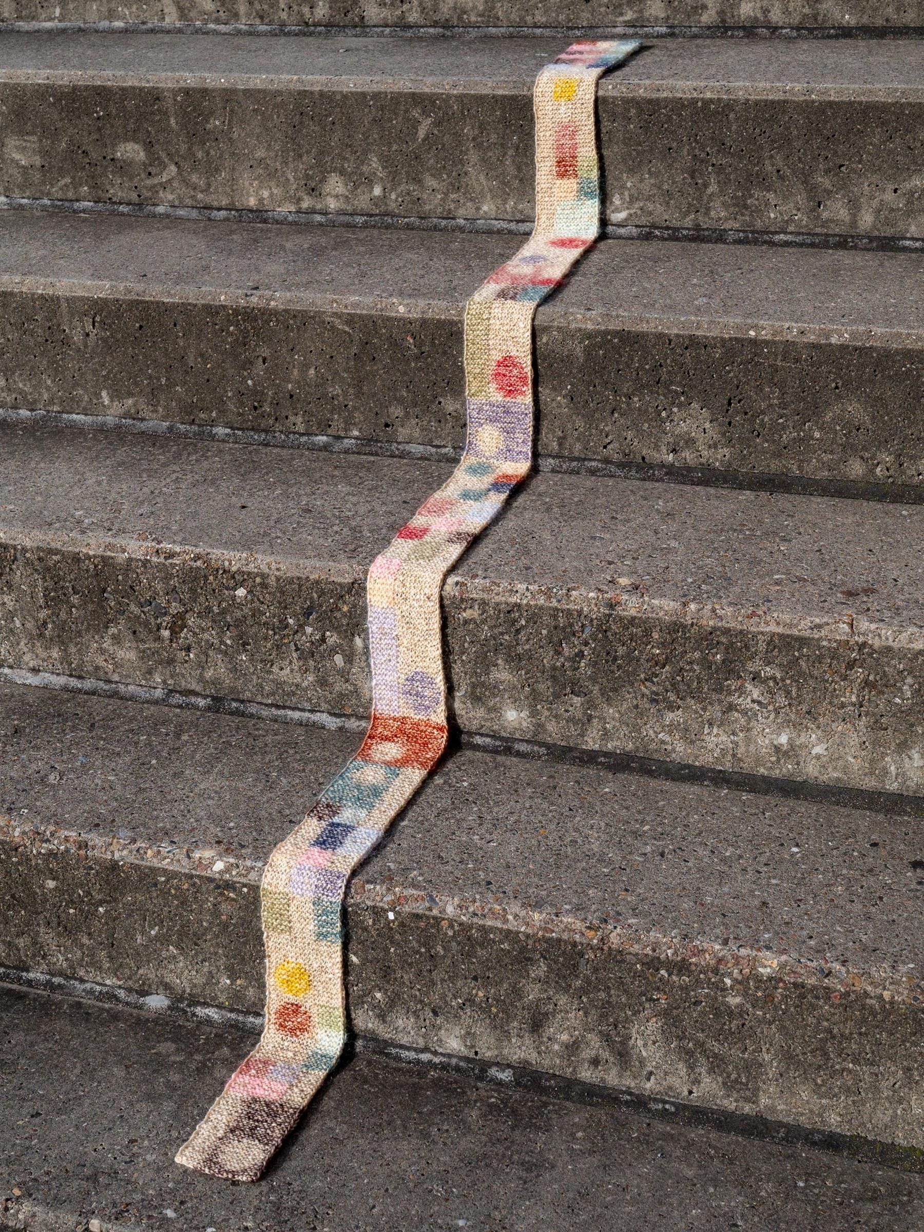 Anna Husemann’s colorful scarf on steps