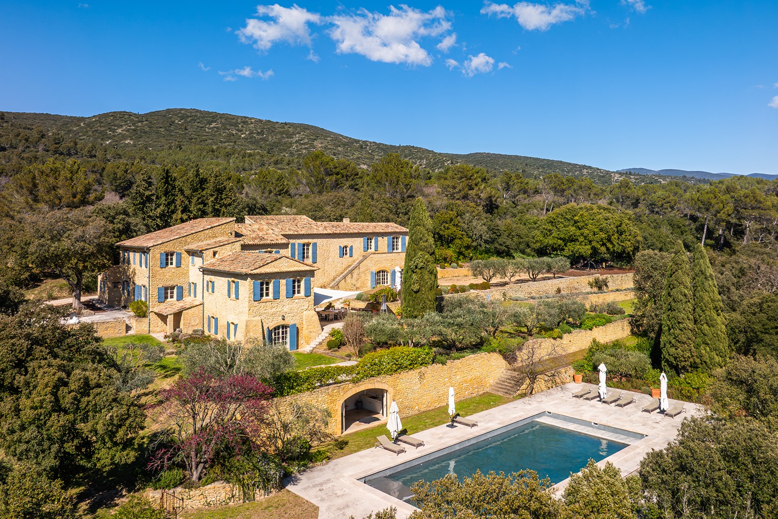 Full view of the property with a view of the pool.