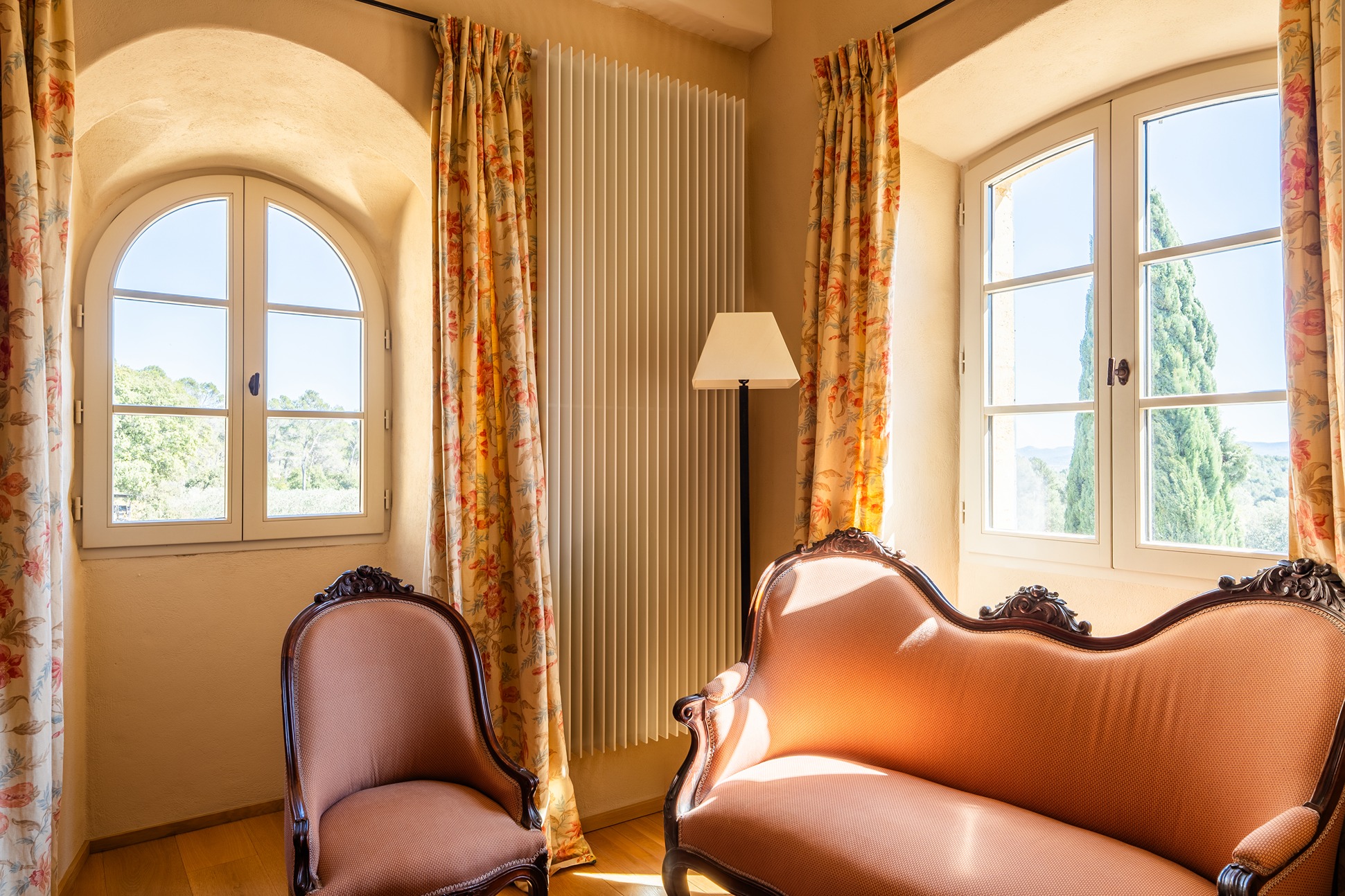 View of a sitting area inside the property with sunlight pouring in.