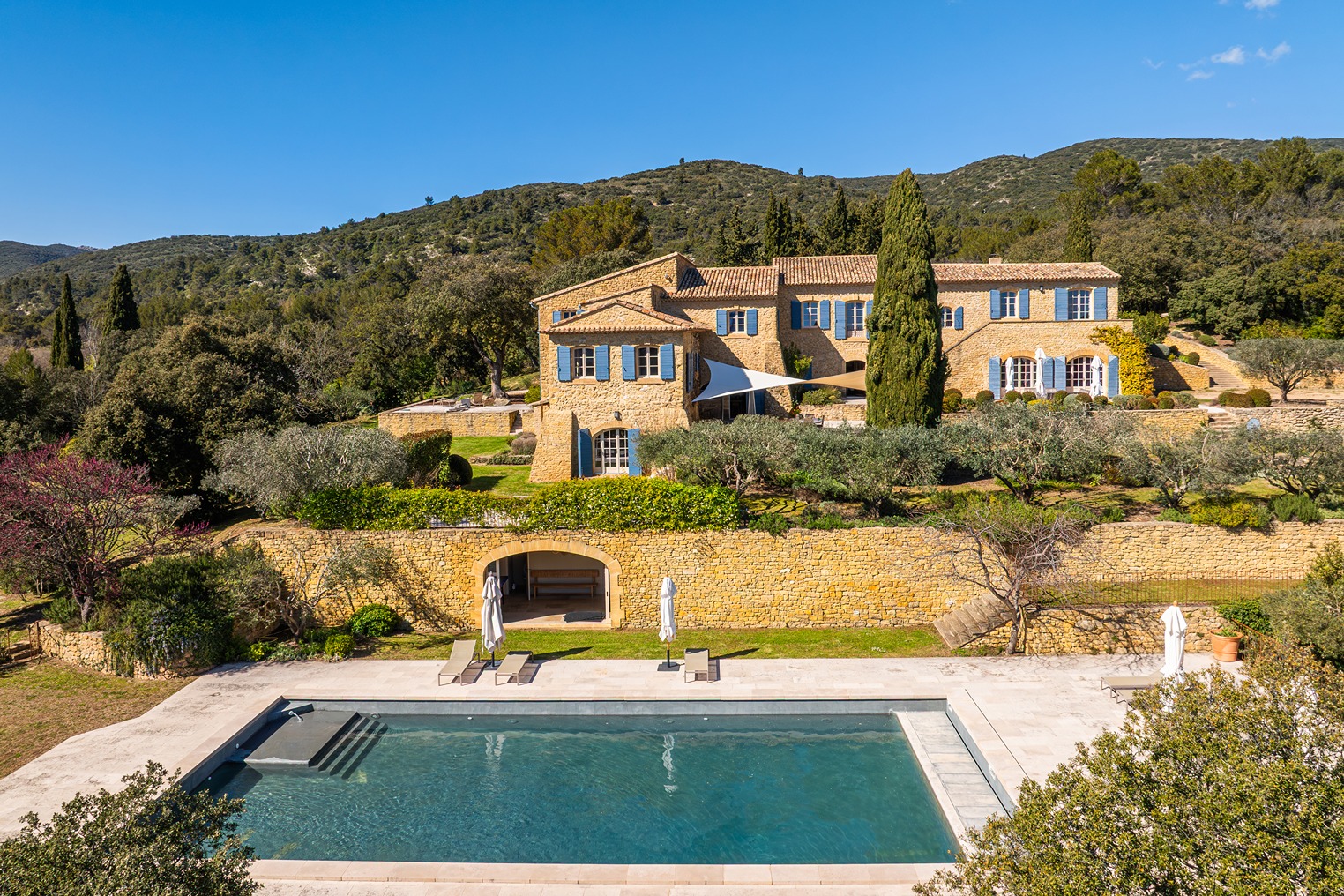 The pool in view with the property in the background.