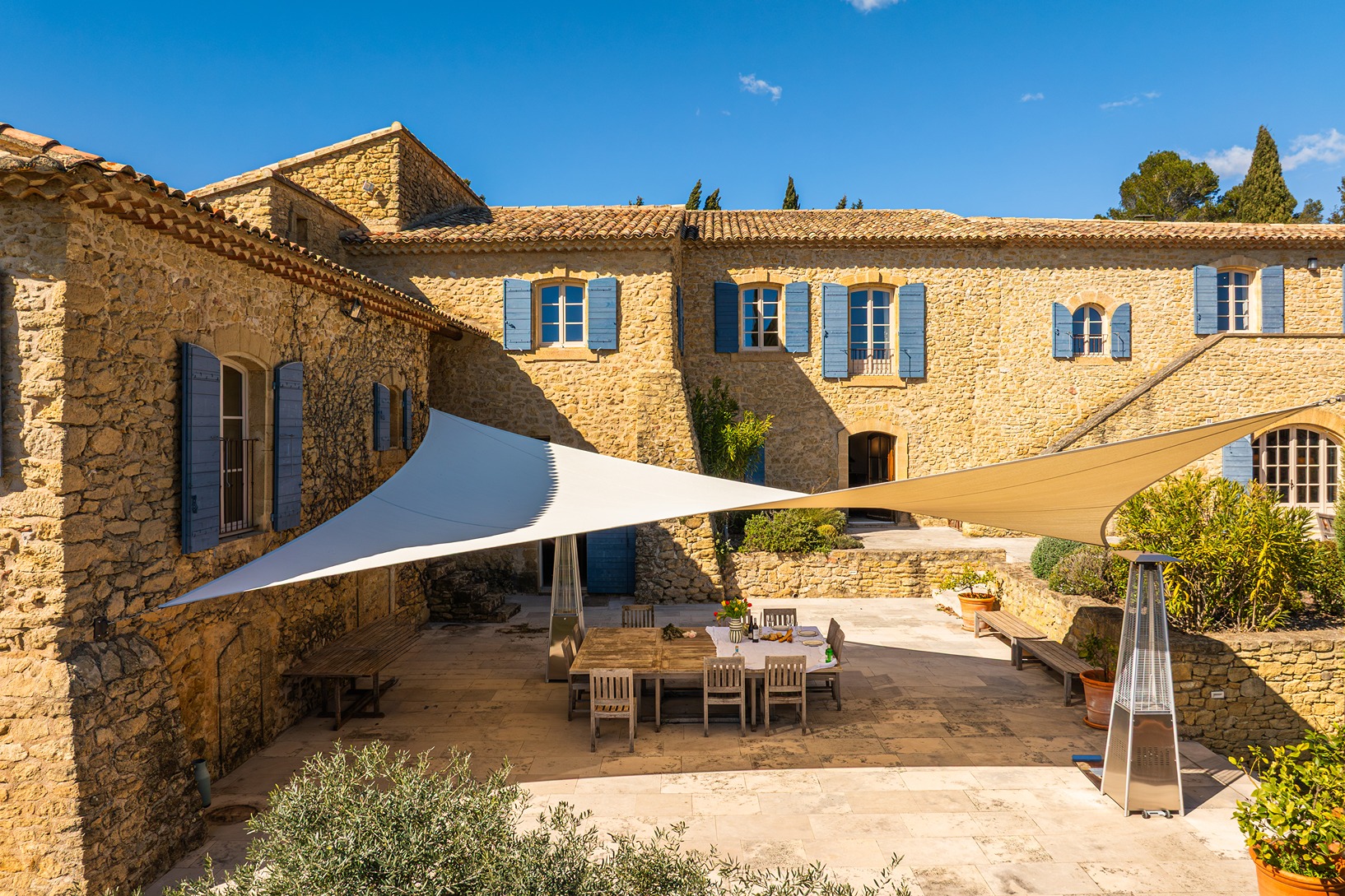 The outside sitting area on the property covered in shade.